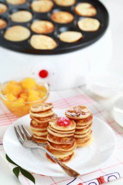 Sweet pancakes with pancake maker clipart