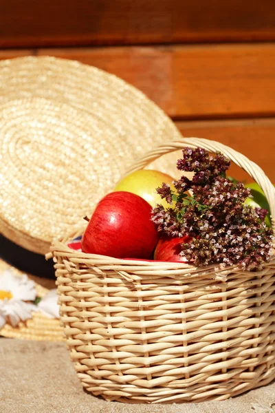 Basket with apples and herbs — Stock Photo, Image