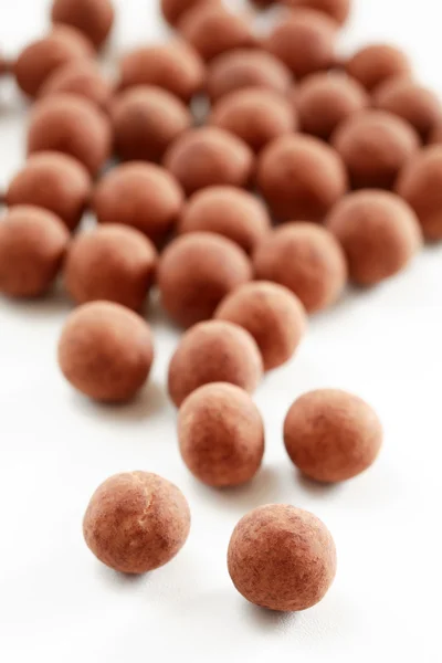 Cacao and chocolate pearls — Stock Photo, Image