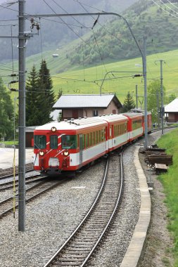 Train passing a village clipart