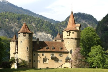 Castle in front of a mountain scenery clipart