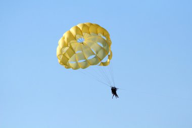 Parachute over the ocean clipart