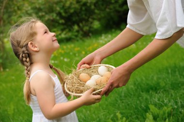 Mother and daughter having Easter time clipart