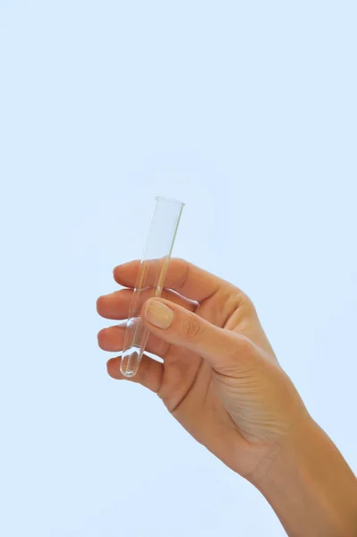 Hand holding test tube — Stock Photo, Image