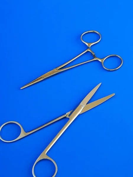 stock image Surgical tools over blue background