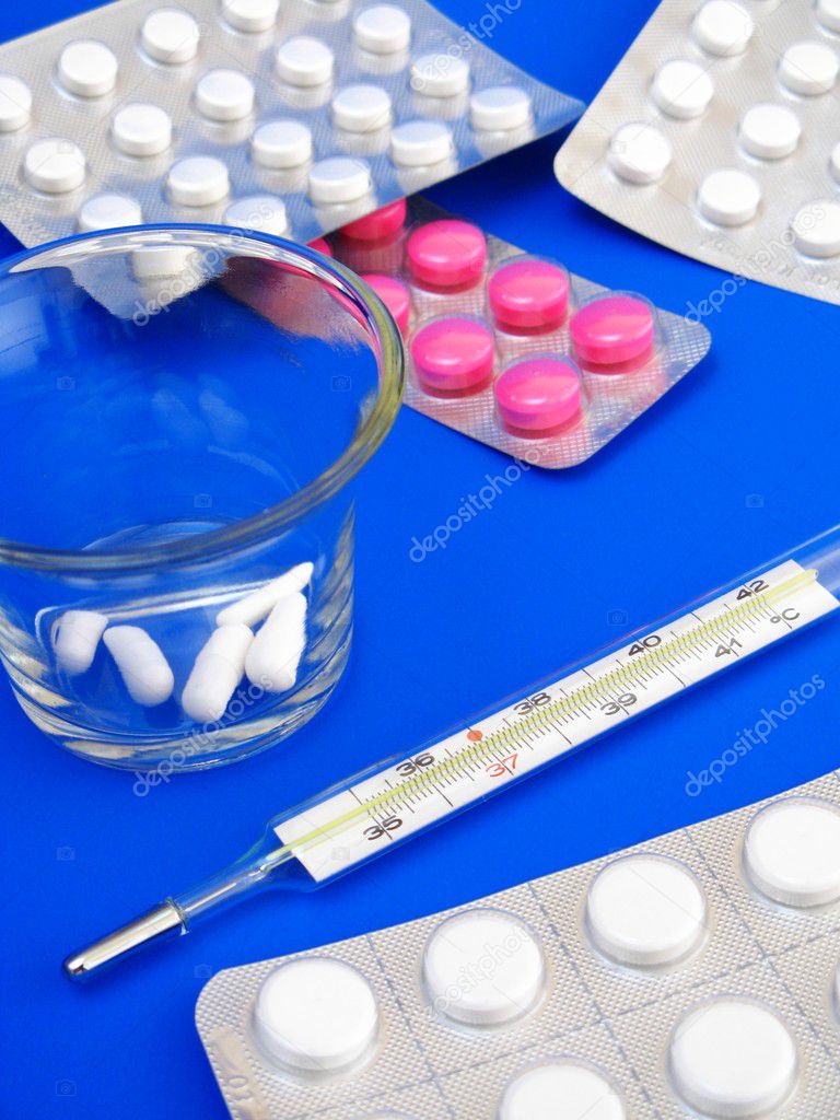 Medical pills and thermometer - detail