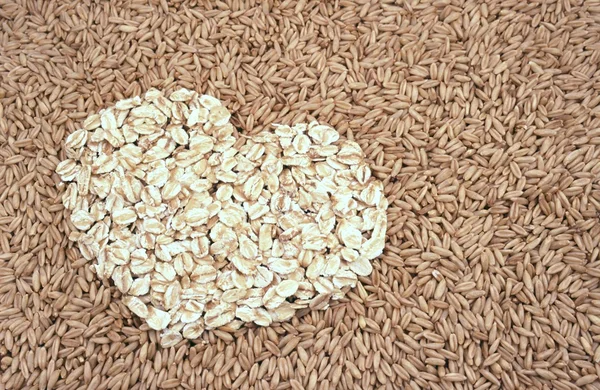 Avena semi e fiocchi d'avena cuore — Foto Stock