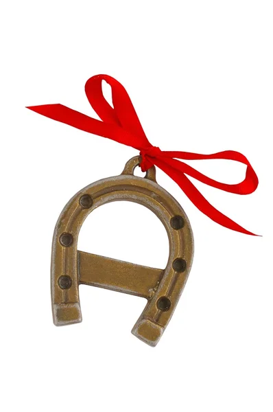 Horseshoe with a red ribbon — Stock Photo, Image