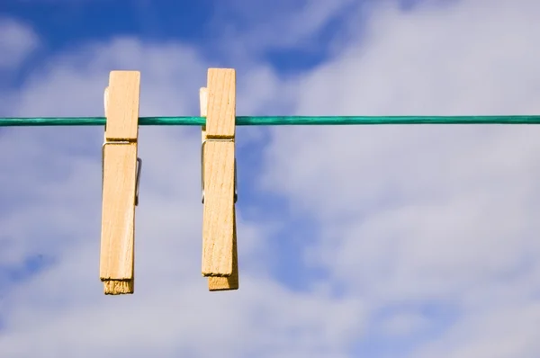 stock image Pegs hang on a washing line