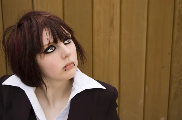 stock image Woman with eyeliner and lip piercings