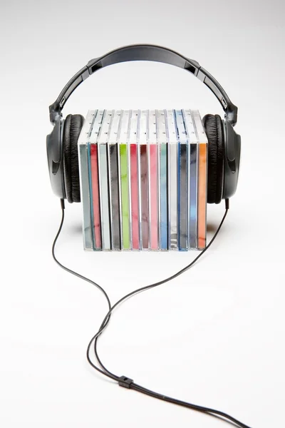 stock image Headphones on cd's