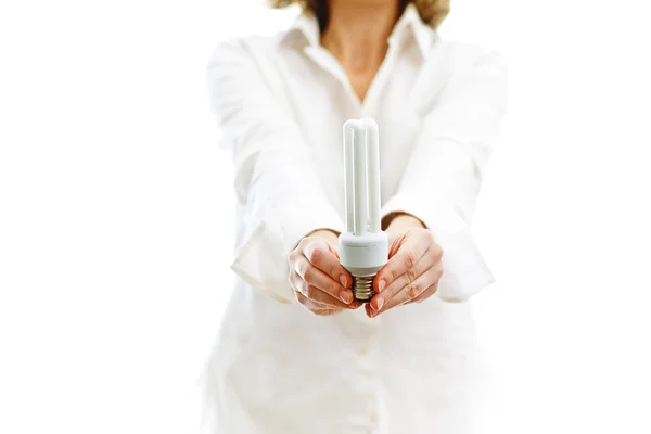 Fluorescent bulb in hands — Stock Photo, Image