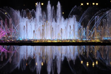 A fountain at night clipart