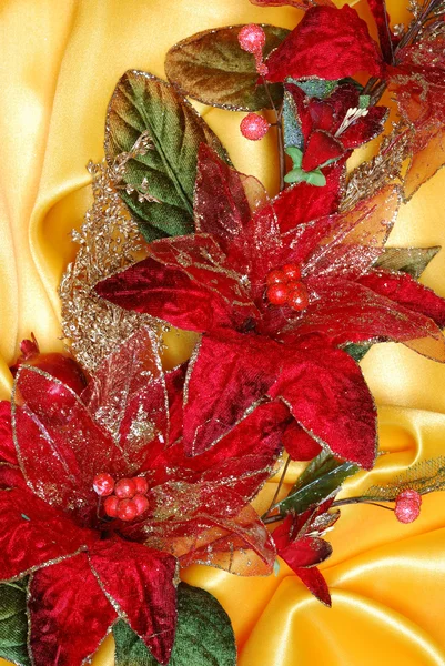Christmas decoration on golden sateen — Stock Photo, Image
