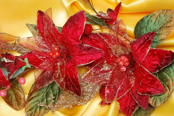 Christmas decoration on golden sateen — Stock Photo, Image