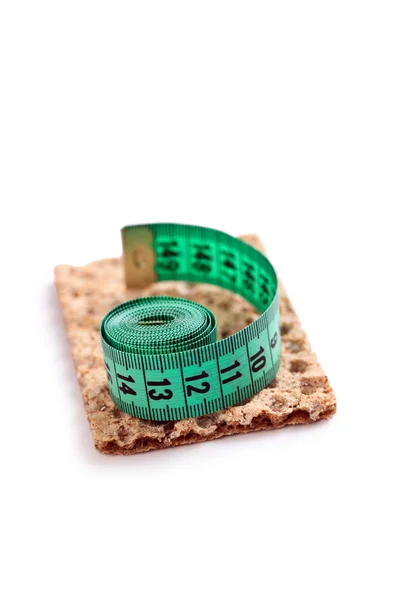 Crispbread with measuring tape — Stock Photo, Image