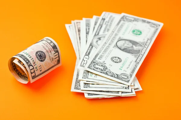Dollars on color background — Stock Photo, Image