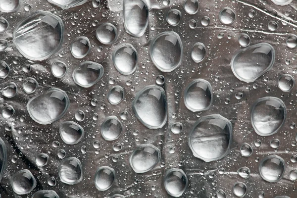 Water drops on silver — Stock Photo, Image
