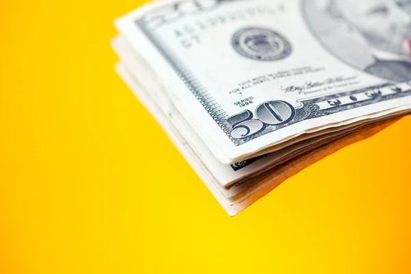 Dólares sobre fondo de color — Foto de Stock