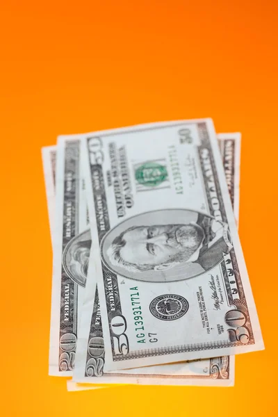 Dólares no fundo de cor — Fotografia de Stock