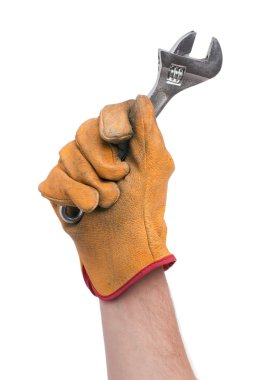 Adjustable wrench in hand clipart