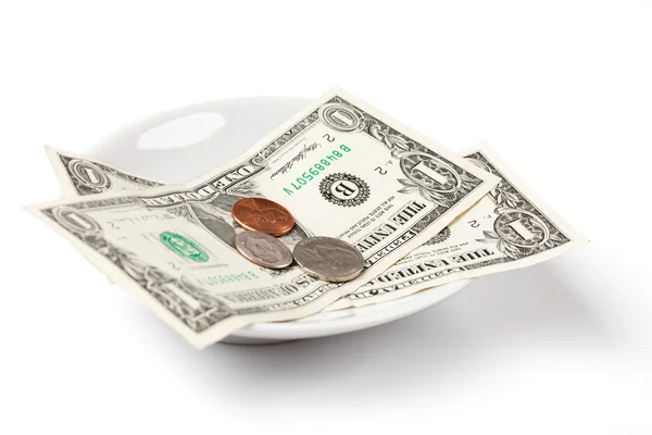 Pagar con dinero en el plato — Foto de Stock