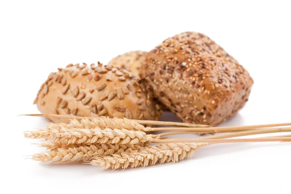 Bread rolls and wheat — Stock Photo, Image