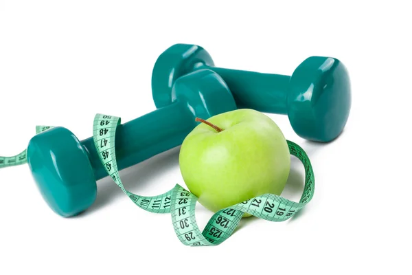 Green dumbell and apple — Stock Photo, Image