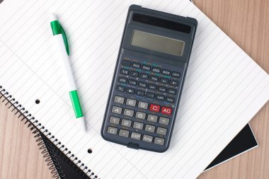 Calculator,pen and notebook clipart