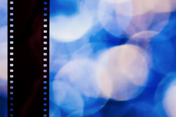 Film strip on color background — Stock Photo, Image