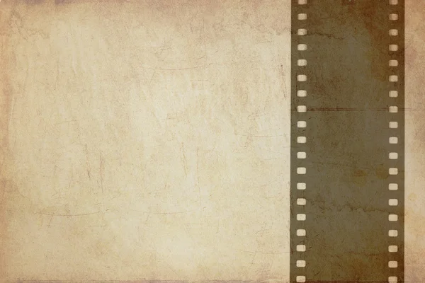 Grunge background with film strip — Stock Photo, Image