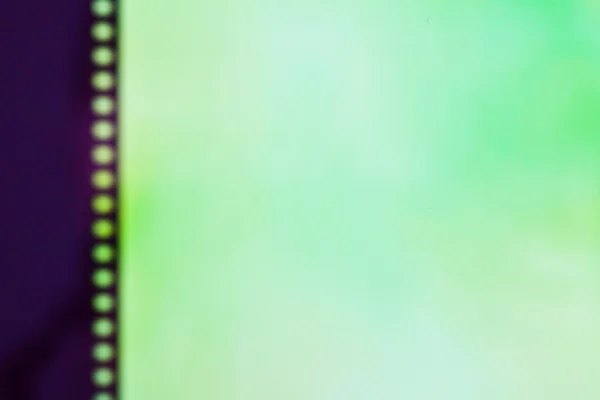 Tira de película sobre fondo de color — Foto de Stock