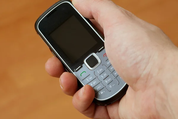 Mobiltelefon a kézben — Stock Fotó