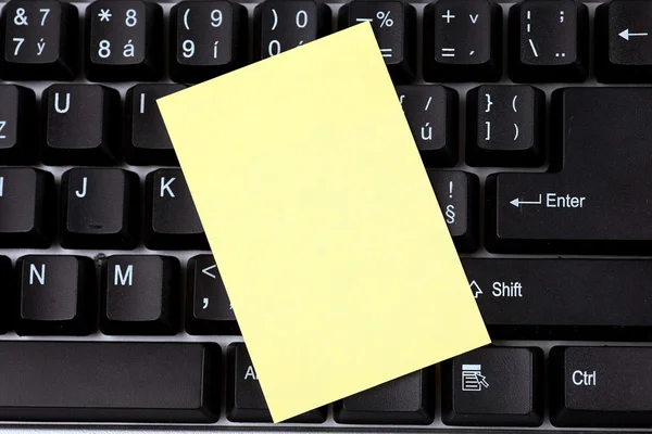 stock image Blank notepaper on keyboard