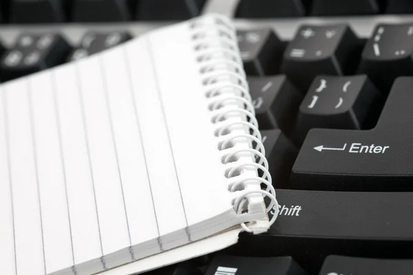 Blank notebook on keyboard — Stock Photo, Image