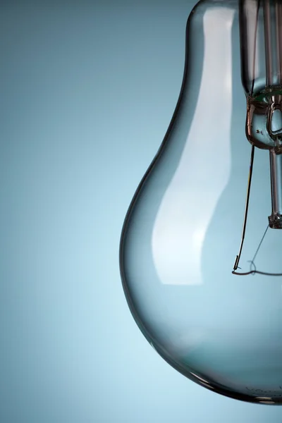 Detail of light bulb on blue background — Stock Photo, Image