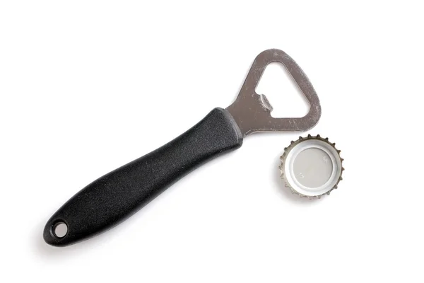 Beer caps and opener — Stock Photo, Image