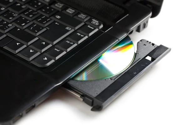 CD disk na notebooku — Stock fotografie