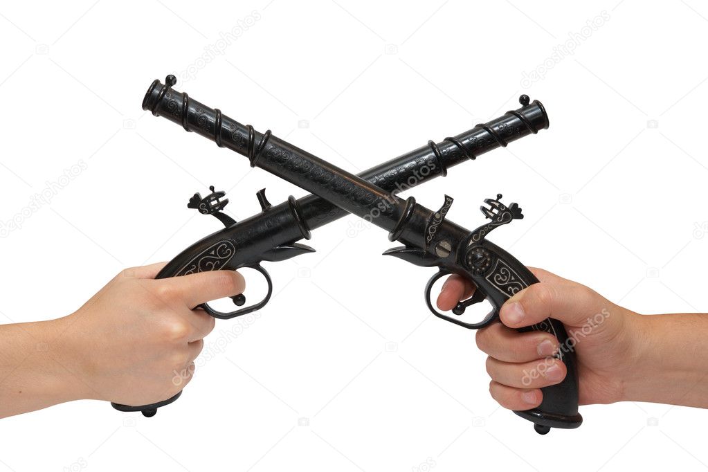 Two hands with an old pistol