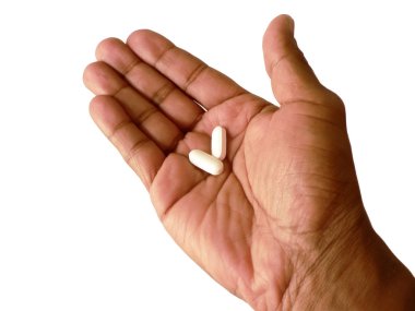 Aspirin in open hand clipart