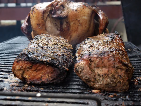 Pork loin & turkey on grill — Stock Photo, Image