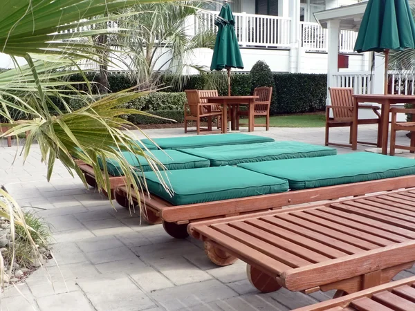 stock image Resort - loungechairs at poolside