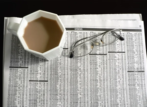 Newspaper - stocks, coffee, eyeglasses 2 — Stock Photo, Image