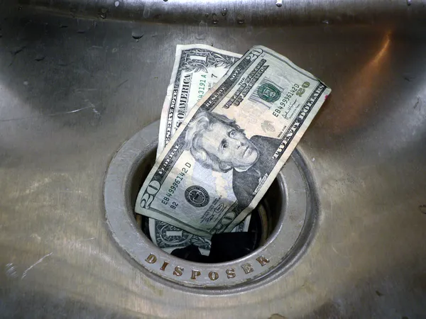 Деньги в канализацию 2 — стоковое фото