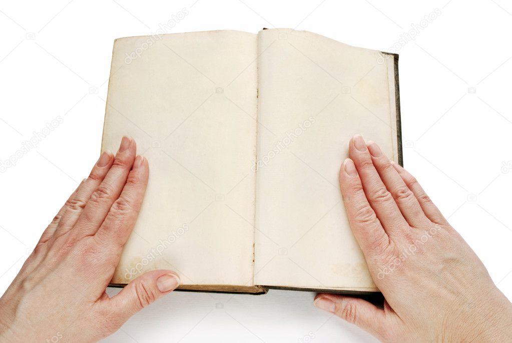 Hands on open empty book