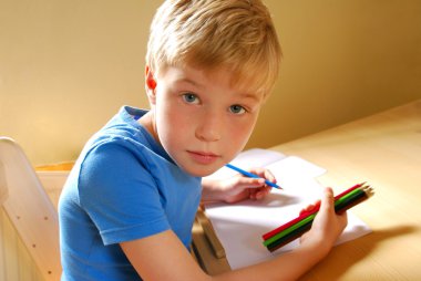 Cute left handed boy clipart