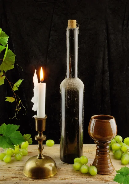 Vintage wine and candlestick — Stock Photo, Image