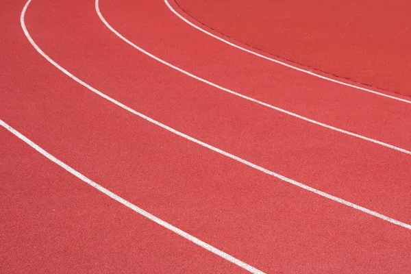 Curve of the red running track — Stock Photo, Image