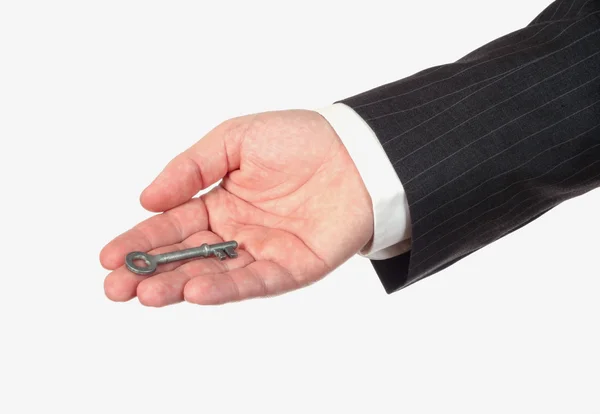Empresario sosteniendo llave — Foto de Stock