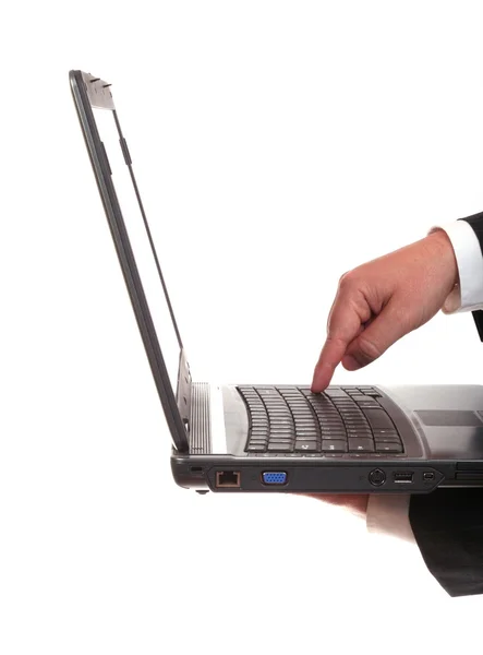 Man's hand op een laptop — Stockfoto